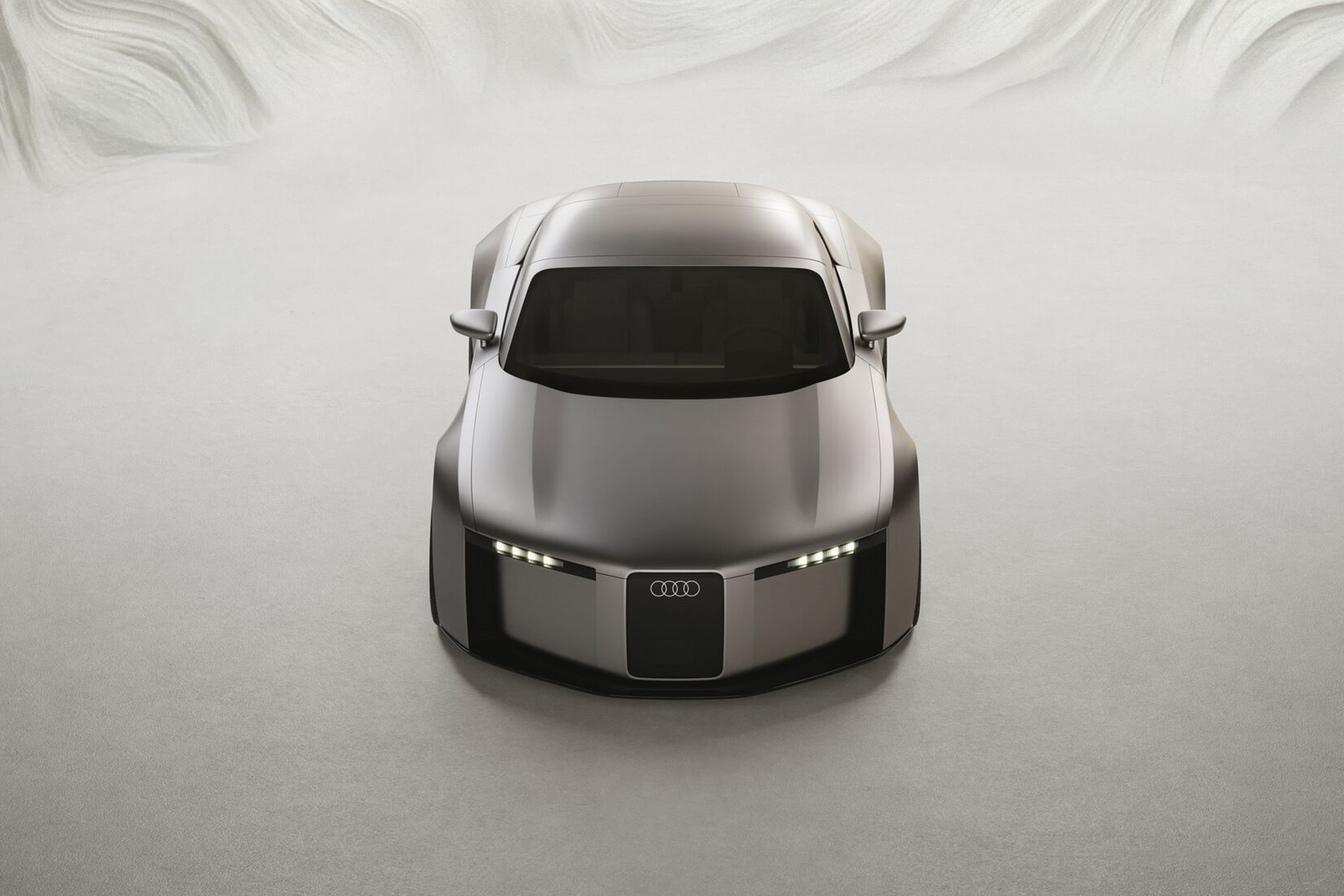 Ein futuristischer Audi Concept C in schr&auml;gen Draufsicht, von vorn, in einem virtuellem Raum